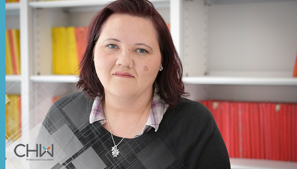 Christie McLelland Headshot with CHW Logo in foreground