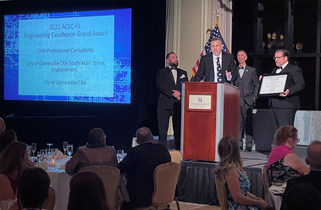 CHW Leadership Team accepts the ACEC-FL Engineering Excellence Grand Award for South Main